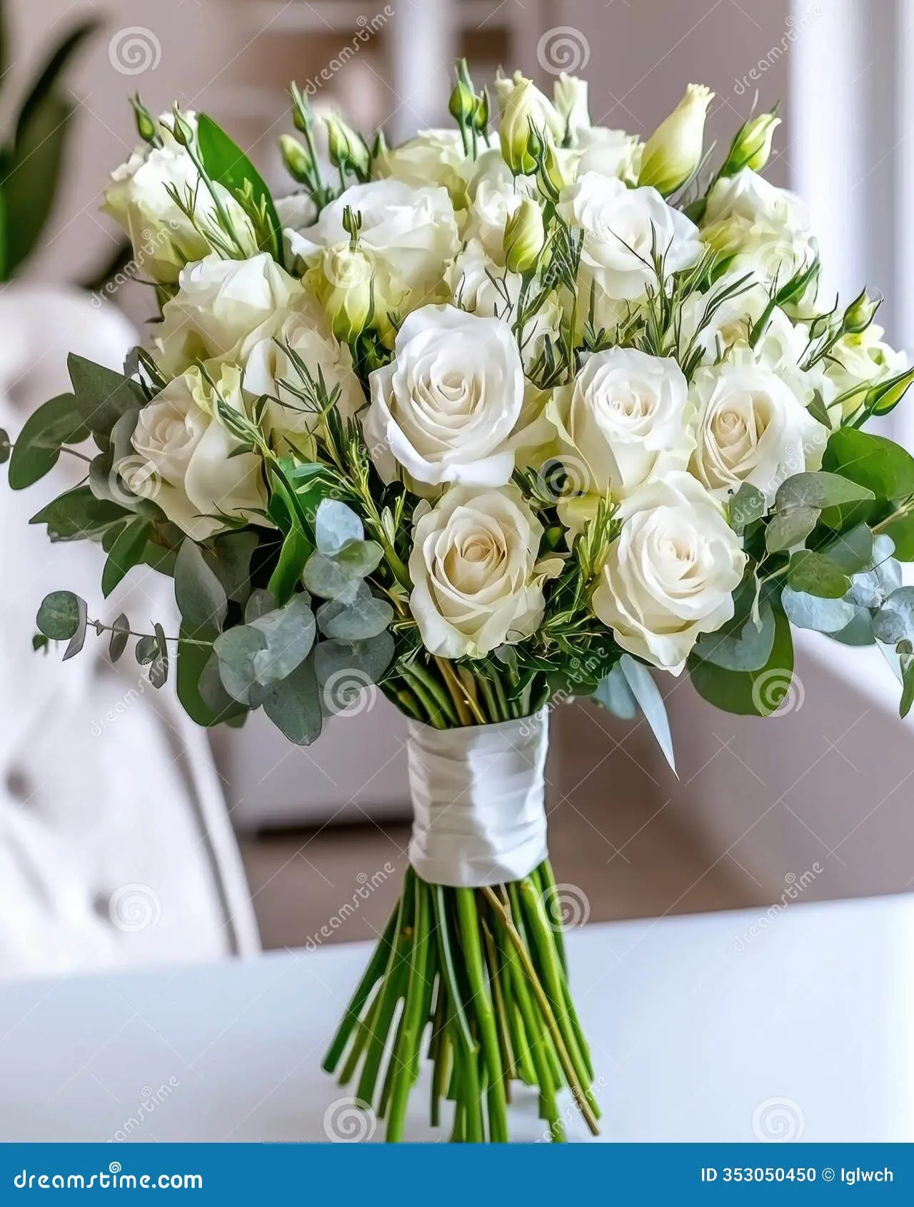 A bouquet of sympathy flowers placed on a neutral background