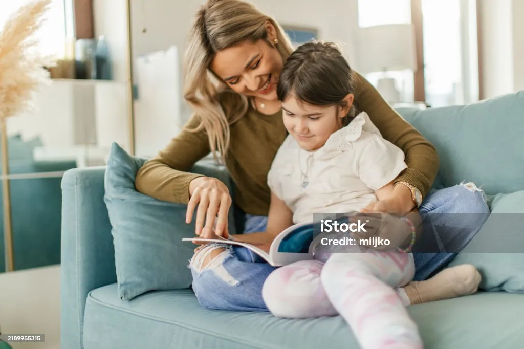 A touching moment of an aunt and niece reading a birthday card together