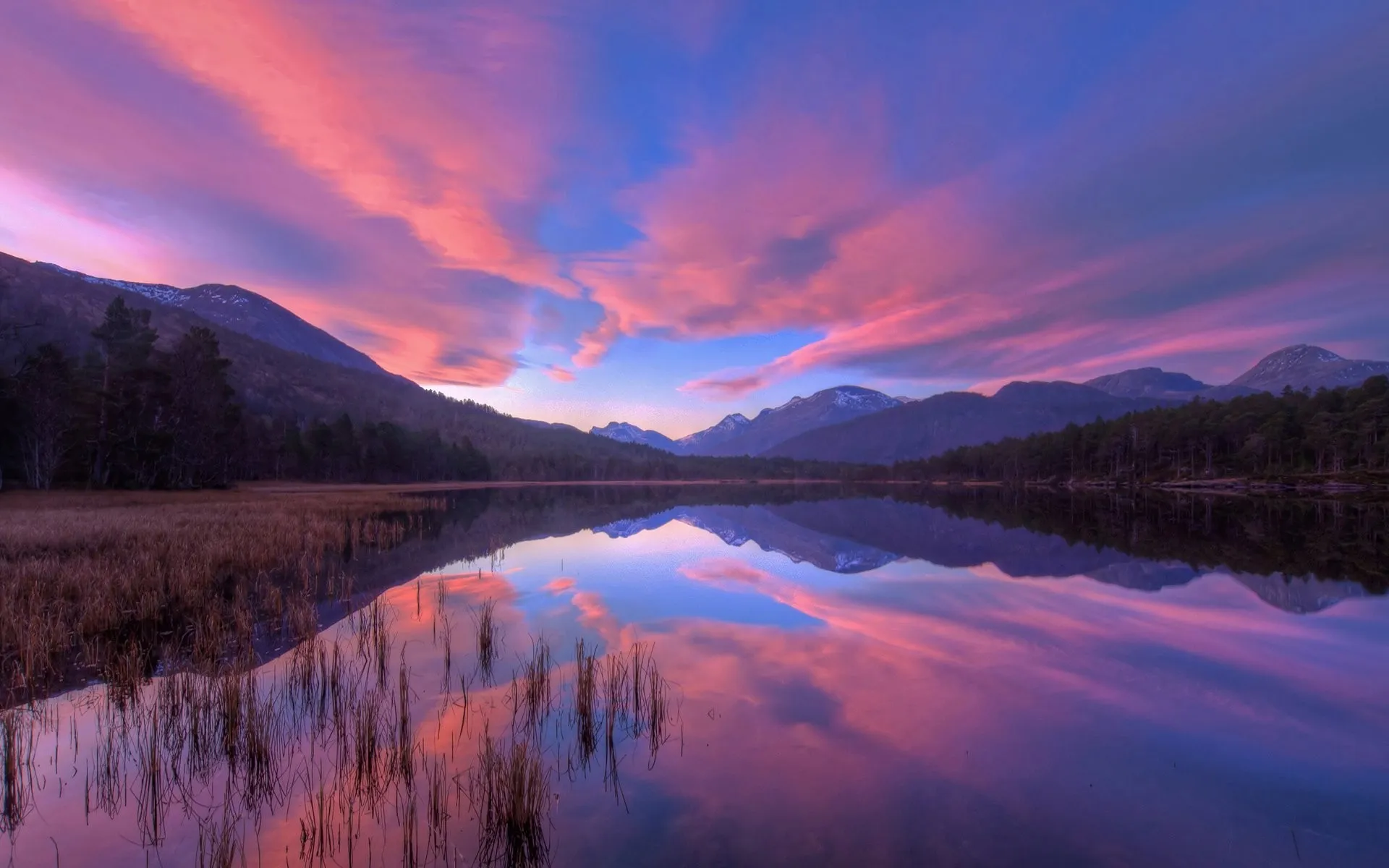 A peaceful view of a sunset over a calm lake, representing reflection and peace.