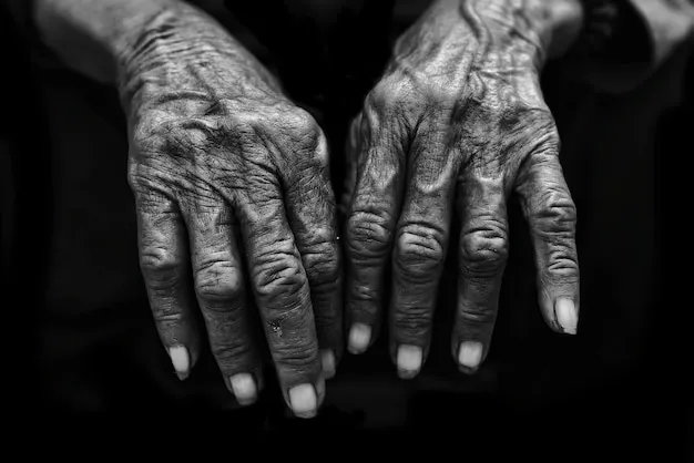 A pair of hands gently holding an old, cherished photograph, symbolizing the preservation of family history and memory.