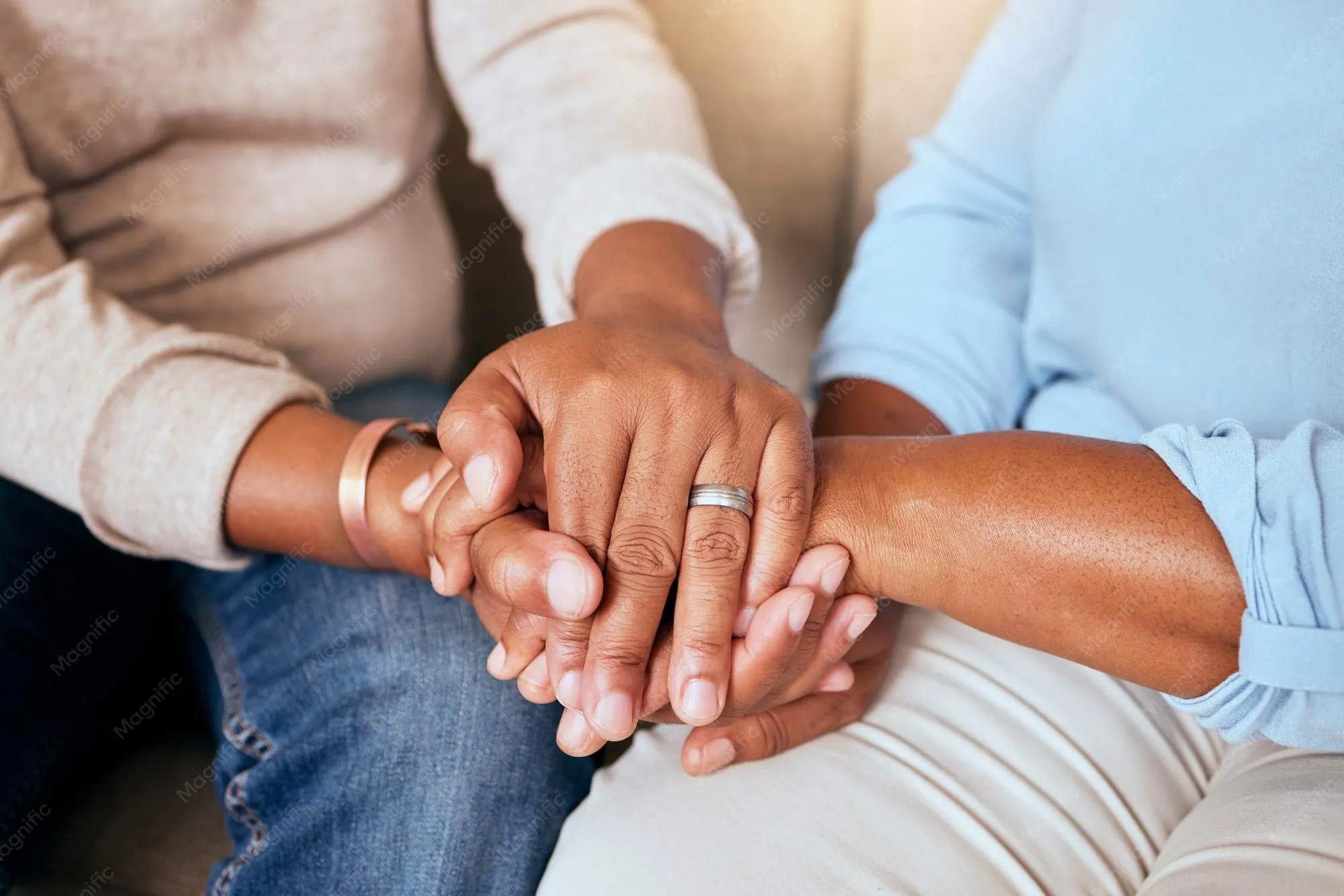 Comforting hands holding each other